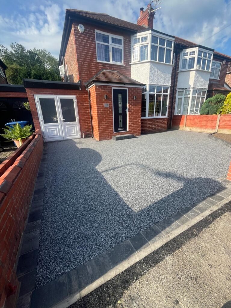 Completed New Palazzo resin-bound driveway with slate-grey edging in Sale