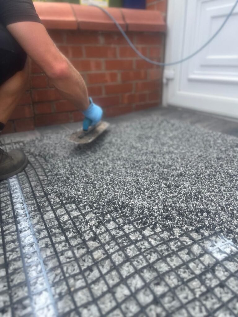 Installing New Palazzo resin-bound surfacing on a driveway in Sale